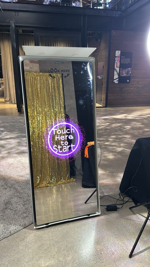 Mirror Photo Booth in Bracebridge with a gold photobooth backdrop.