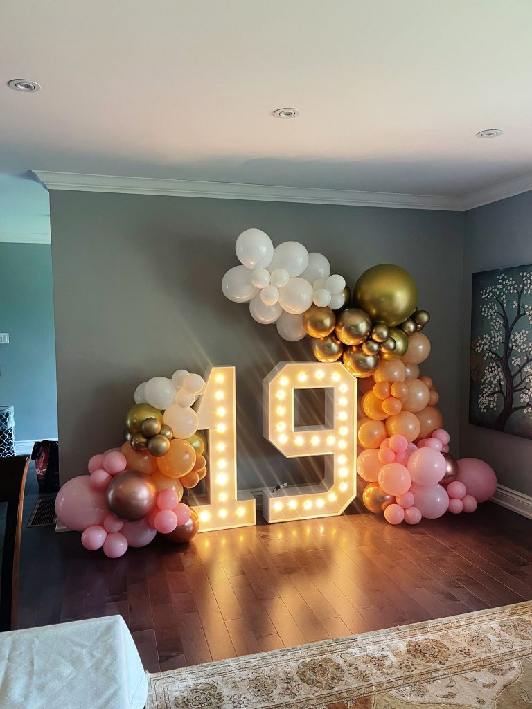 Kawartha lakes marquee decor framed with balloon garlands